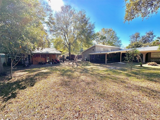 view of yard featuring a sunroom