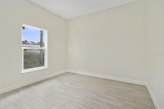 empty room featuring light tile patterned floors