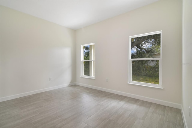 spare room featuring light wood-type flooring