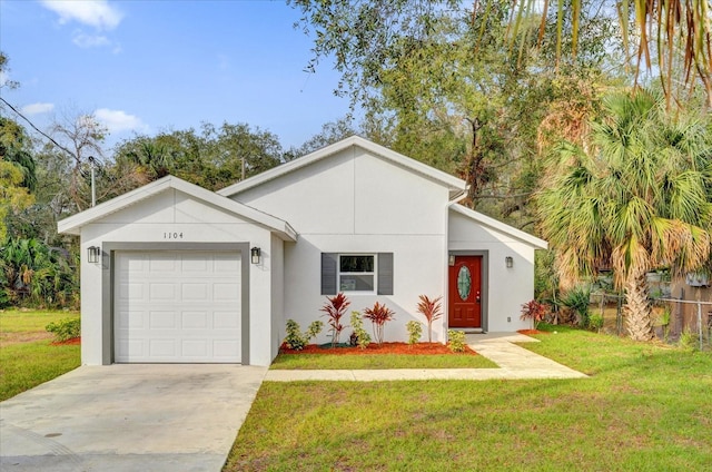 view of front of property with a front yard and a garage