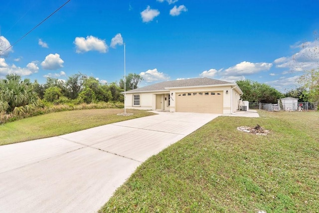 view of front of house featuring a front yard and a garage