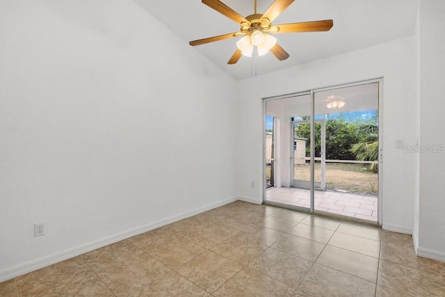 tiled empty room featuring ceiling fan and lofted ceiling