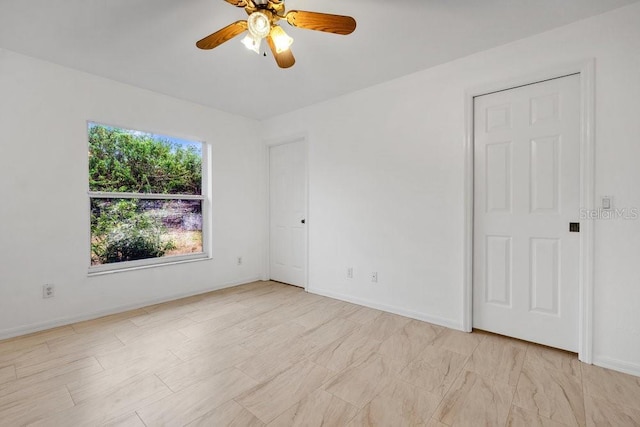 spare room featuring ceiling fan