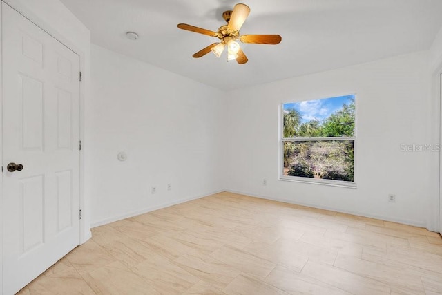 spare room featuring ceiling fan