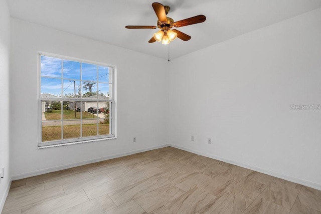 unfurnished room with ceiling fan