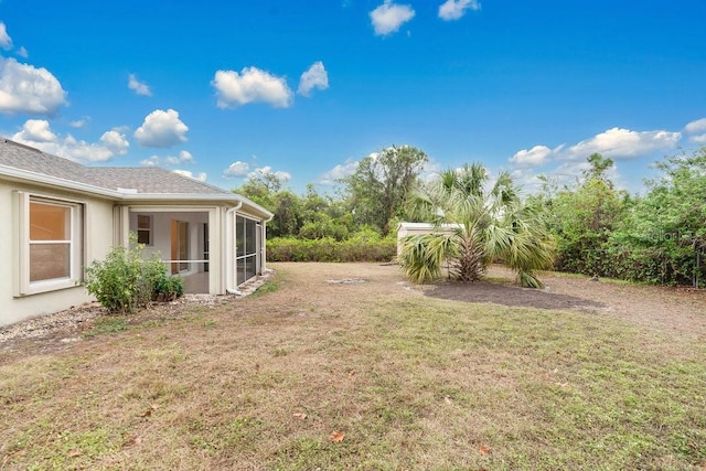 view of yard featuring a sunroom