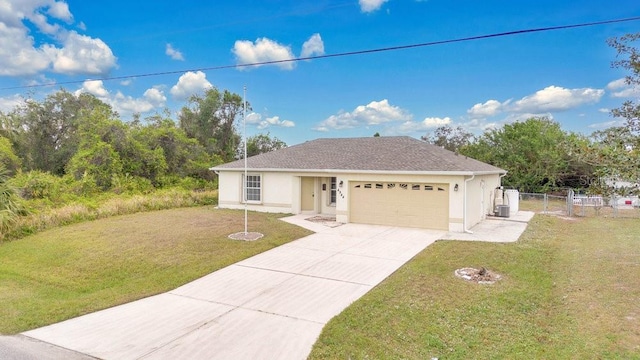 view of front of property featuring a garage and a front lawn