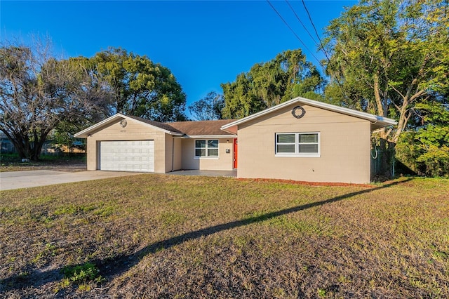 single story home with a garage and a front yard