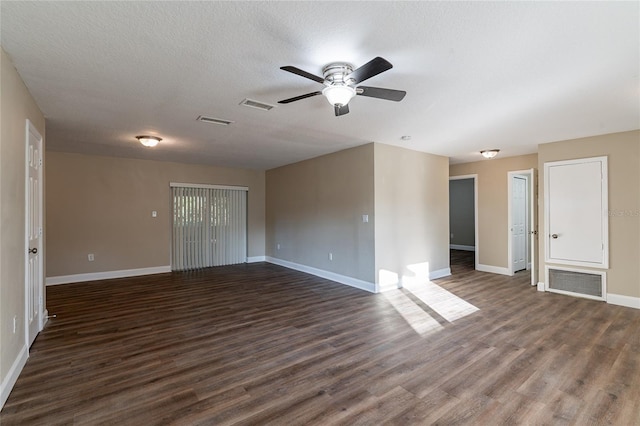 unfurnished room featuring ceiling fan and dark hardwood / wood-style floors