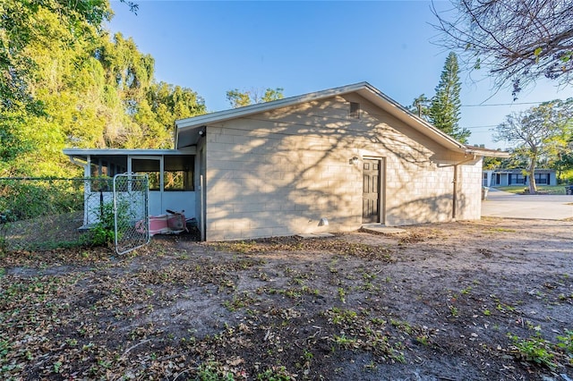 back of house with a sunroom