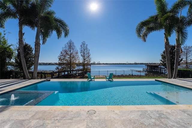 view of swimming pool with a water view