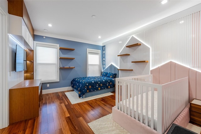 bedroom with hardwood / wood-style floors