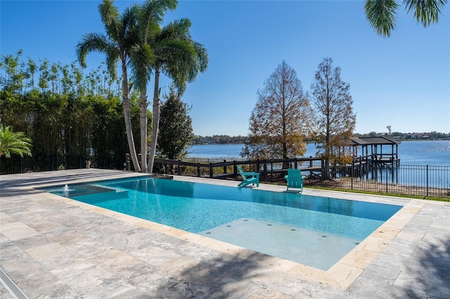 view of swimming pool featuring a water view and a patio area