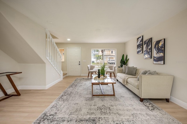 living room with light hardwood / wood-style flooring