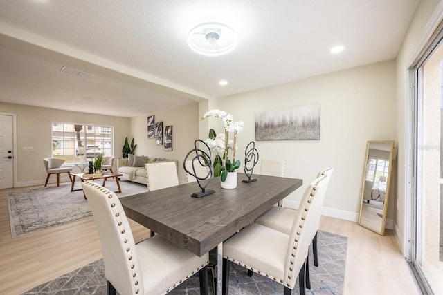 dining area with light hardwood / wood-style flooring