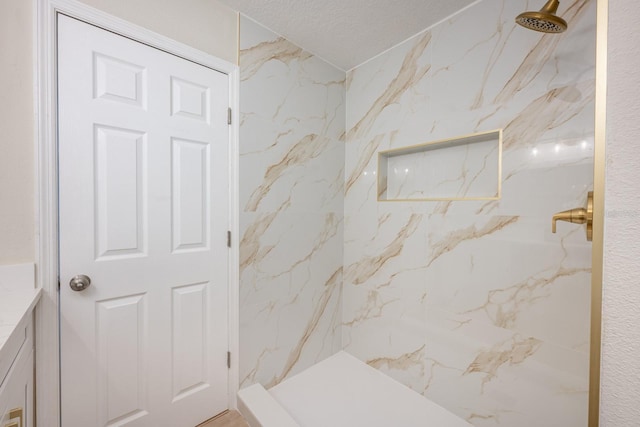 bathroom featuring tiled shower