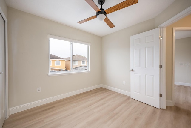 unfurnished bedroom with ceiling fan and light hardwood / wood-style floors