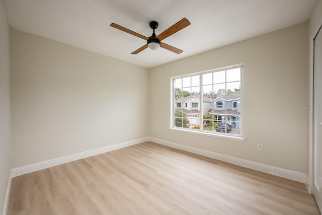 spare room with ceiling fan and light hardwood / wood-style flooring