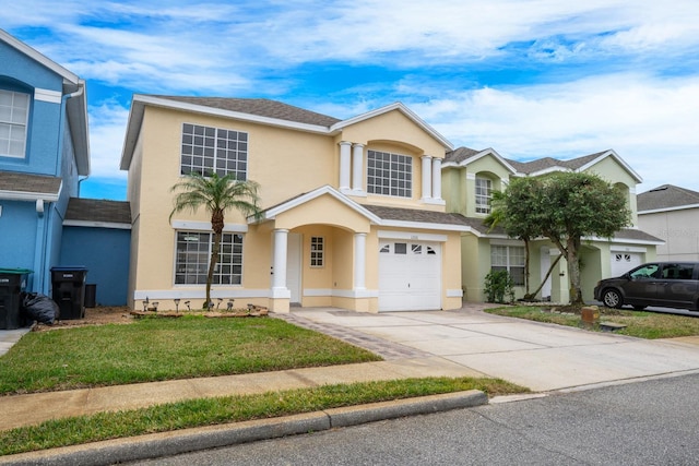 view of front of home with a garage and a front yard