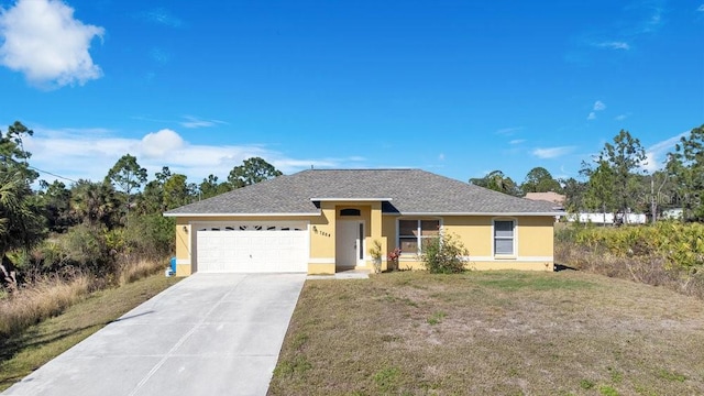 ranch-style house with a front yard and a garage