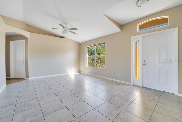 tiled entrance foyer featuring ceiling fan and vaulted ceiling