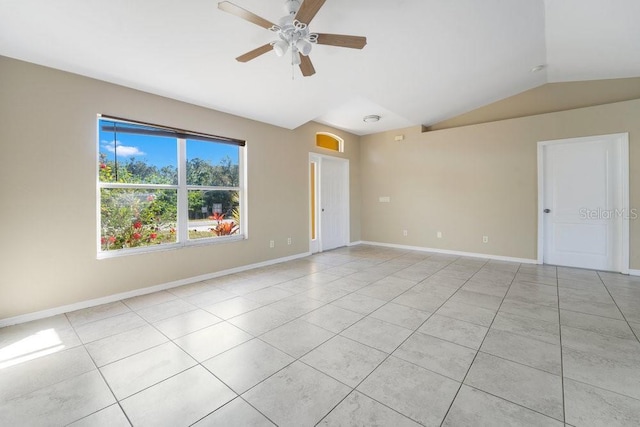 tiled empty room featuring ceiling fan and lofted ceiling