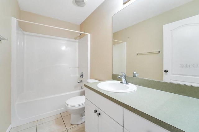 full bathroom featuring toilet, vanity, bathing tub / shower combination, and tile patterned floors