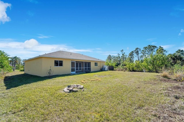 back of house with a yard