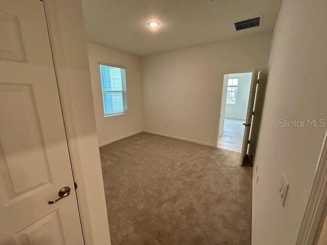 unfurnished room with carpet floors