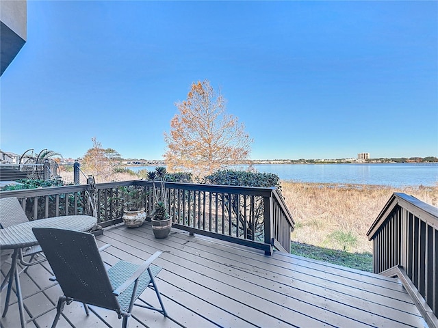 wooden deck with a water view