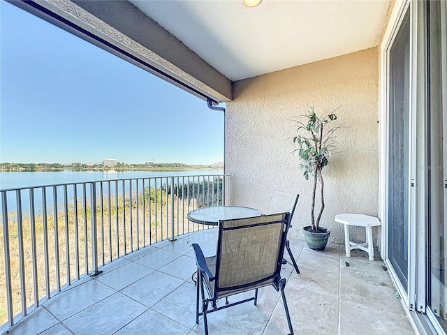 balcony featuring a water view