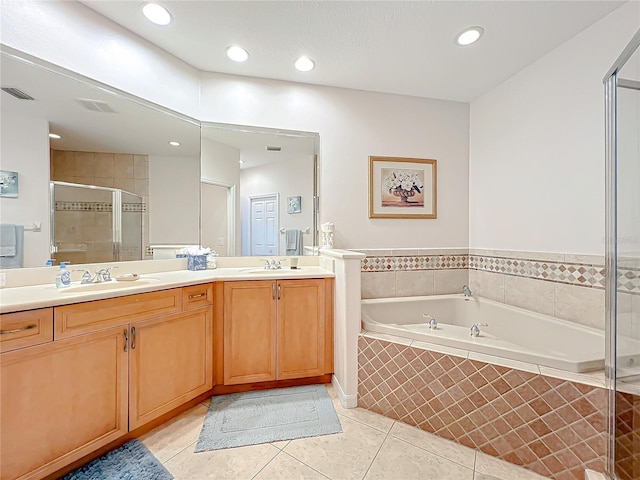 bathroom featuring tile patterned floors, vanity, and plus walk in shower