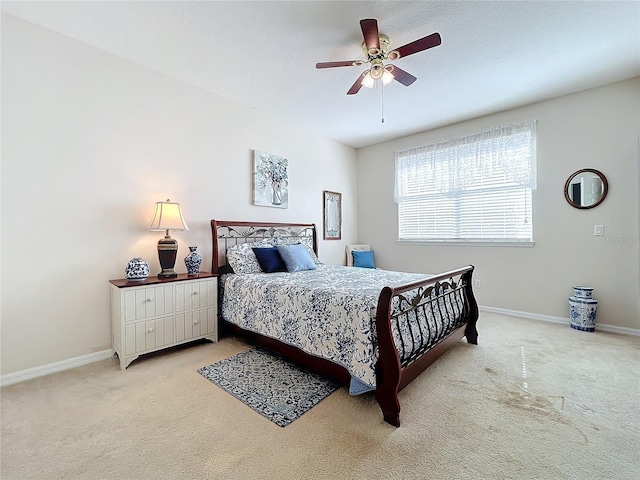 bedroom featuring ceiling fan and light colored carpet