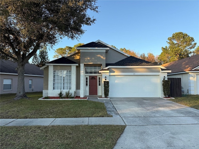 view of front of house with a front lawn and a garage