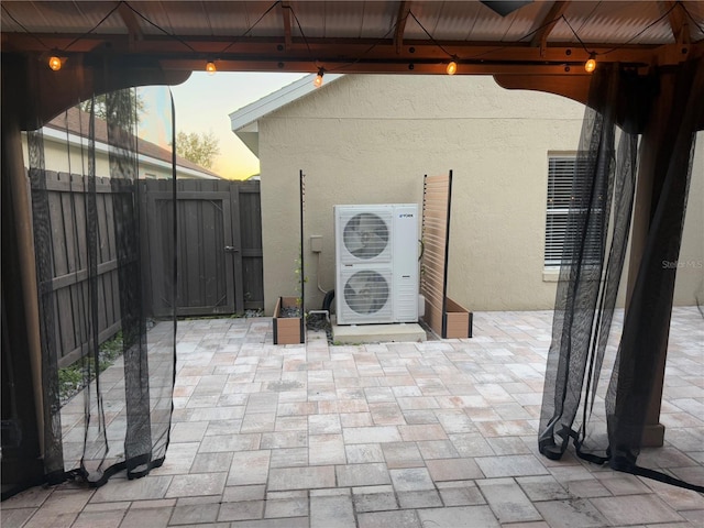 patio terrace at dusk with ac unit