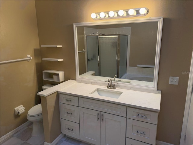 bathroom featuring tile patterned floors, a shower with door, vanity, and toilet