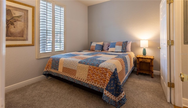 carpeted bedroom featuring multiple windows