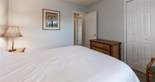 carpeted bedroom with a closet