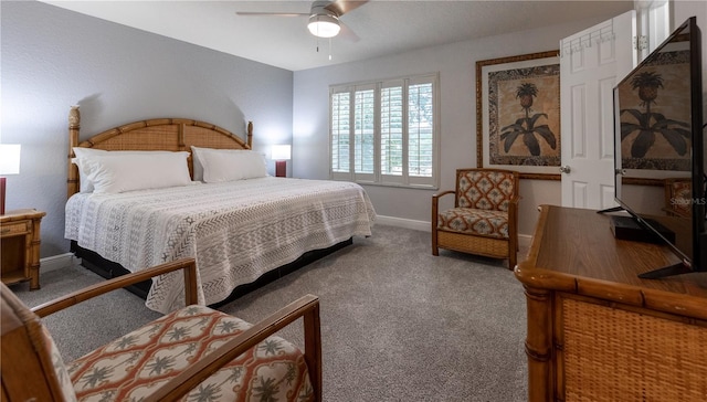 bedroom featuring ceiling fan and carpet