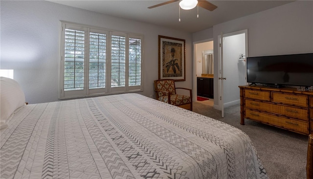 bedroom with carpet, connected bathroom, and ceiling fan