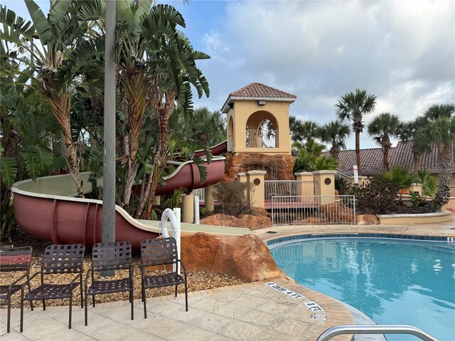 3428 Calabria Ave, Davenport, FL 33897 - community pool with a patio