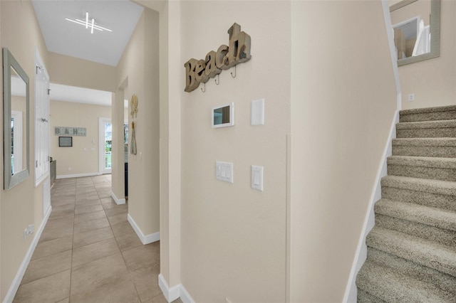 hallway with light tile patterned floors