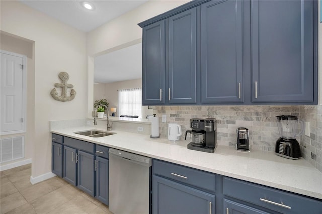 kitchen with backsplash, sink, blue cabinetry, dishwasher, and light tile patterned flooring