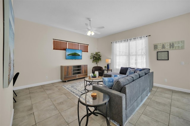 tiled living room with ceiling fan