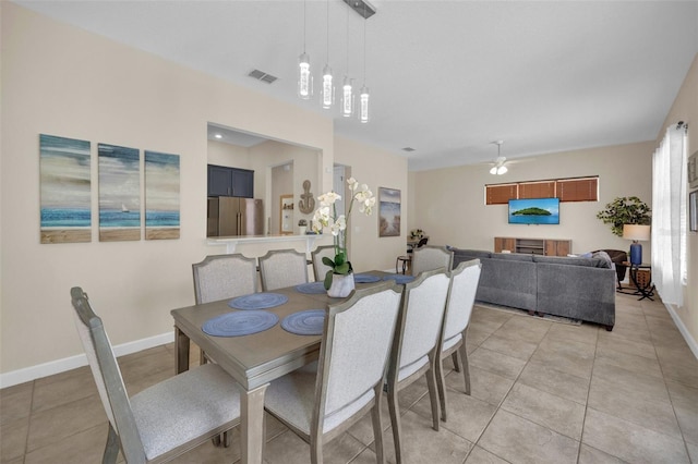 dining room featuring ceiling fan and light tile patterned floors