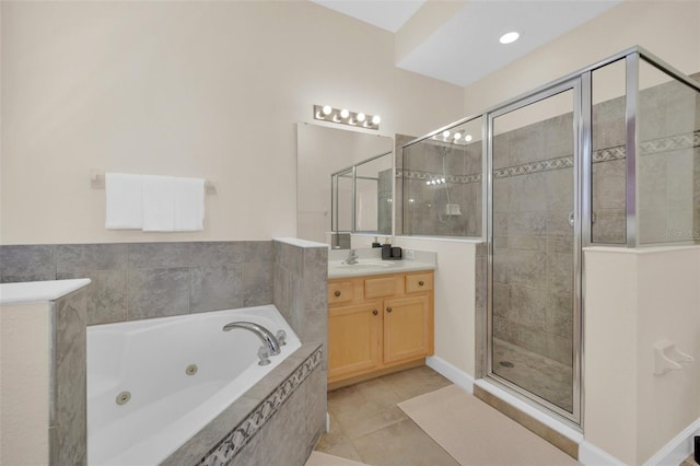 bathroom with tile patterned floors, separate shower and tub, and vanity