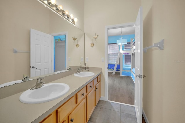 bathroom featuring tile patterned flooring and vanity