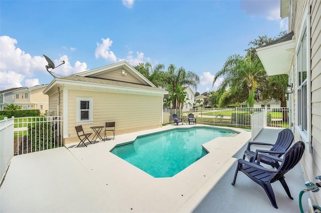 view of swimming pool featuring a patio area