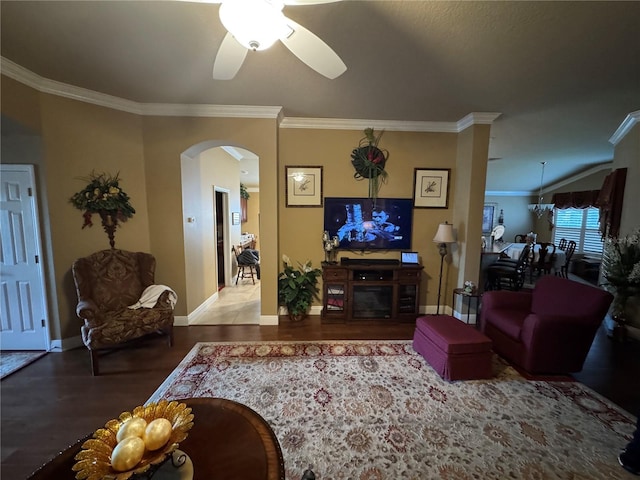 living room featuring ceiling fan, ornamental molding, and hardwood / wood-style floors