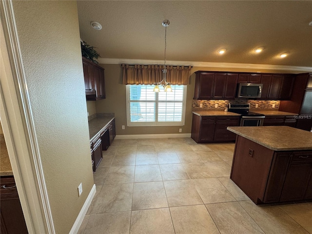 kitchen with light tile patterned flooring, dark brown cabinetry, ornamental molding, appliances with stainless steel finishes, and tasteful backsplash